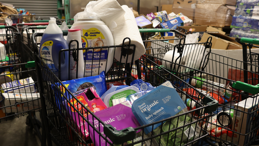 An image of a basket of full of food and toiletry's provided by the Kenner food bank 